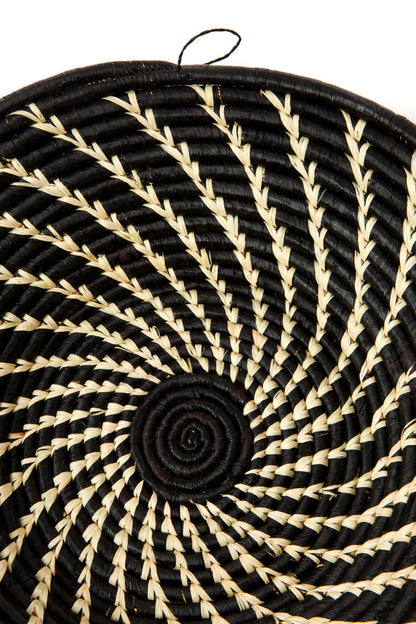 Handwoven coiled African wall baskets with cream swirls